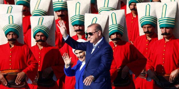 Turkish President Tayyip Erdogan, accompanied by his wife Emine Erdogan, greets supporters during a rally to mark the 563rd anniversary of the conquest of the city by Ottoman Turks, in Istanbul, Turkey, May 29, 2016. REUTERS/Murad Sezer TPX IMAGES OF THE DAY