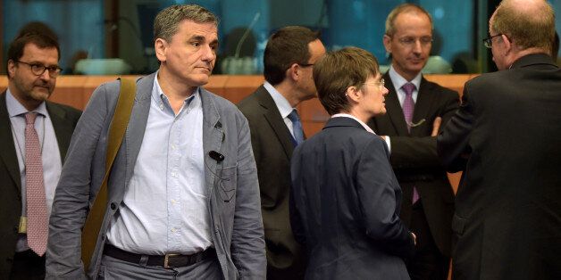 Greece's finance Minister Euclid Tsakalotos arrives at a Euro zone finance ministers meeting to discuss whether Greece has passed sufficient reforms to unblock new loans and how international lenders might grant Athens debt relief, in Brussels, Belgium May 24, 2016. REUTERS/Eric Vidal