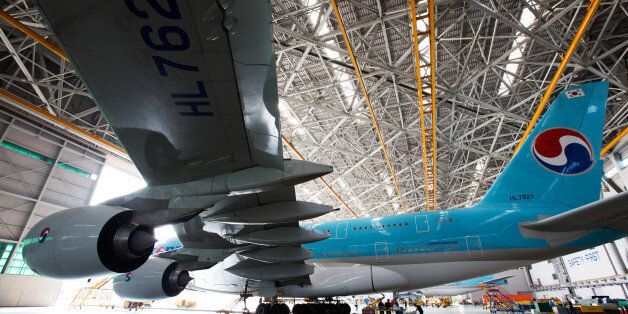 A Korean Air Lines Co. Airbus A380-800 passenger aircraft sits in a hangar at Incheon International Airport in Incheon, South Korea, on Tuesday, Sept. 1, 2015. Korean Air plans to operate the airline's new B747-8 Intercontinental from Seoul on the Frankfurt and Singapore routes. The airline also plans to introduce the aircraft on the San Francisco and Hong Kong routes from November. Photographer: SeongJoon Cho/Bloomberg via Getty Images