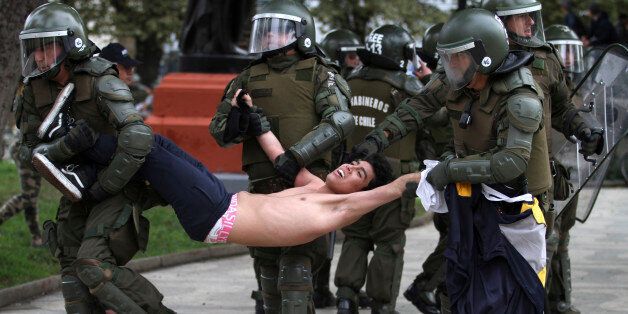 VALPARAISO, CHILE - MAY 26: A protester is detained by the police during a national demonstration organized by ACLE to demand free and quality education on May 26, 2016 in Valparaiso, Chile. (Photo by Marcelo Benitez/Latincontent/Getty Images)