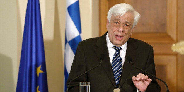 President of Greece, Prokopis Pavlopoulos, speaks to the media during a press conference after a meeting with Cyprus' President Nicos Anastasiades at the presidential palace in the capital Nicosia, Cyprus, Monday, March 30 , 2015. President of Greece Prokopis Pavlopoulos arrived in Cyprus for a two-day official visit, his first since assuming his duties. (AP Photo/Petros Karadjias)