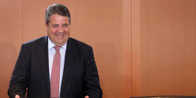 German Minister for Economic Affairs and Energy, Sigmar Gabriel, smiles as he arrives for the weekly cabinet meeting at the Chancellery in Berlin, Germany, Wednesday, April 27, 2016. (AP Photo/Michael Sohn)