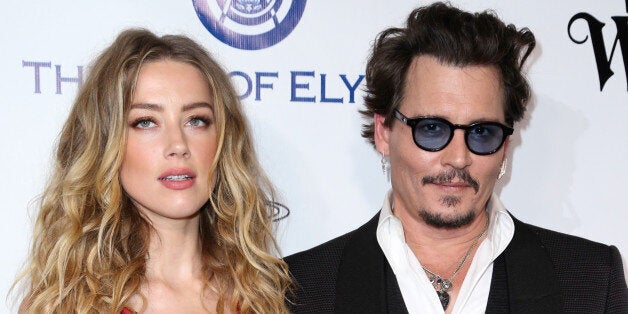 Amber Heard, left, and Johnny Depp arrive at The Art of Elysium's Ninth annual Heaven Gala at 3LABS on Saturday, Jan. 9, 2016, in Culver City, Calif. (Photo by Rich Fury/Invision/AP)