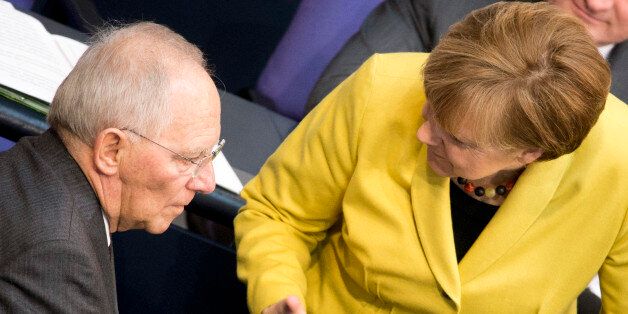 BERLIN, GERMANY - FEBRUARY 27: German Chancellor Angela Merkel and German Finance Minister Wolfgang Schaeuble attend a debate due to the four-month-extension of the Greek bail-out programme on February 27, 2015 in Berlin, Germany. (Photo by Michael Gottschalk/Photothek via Getty Images)