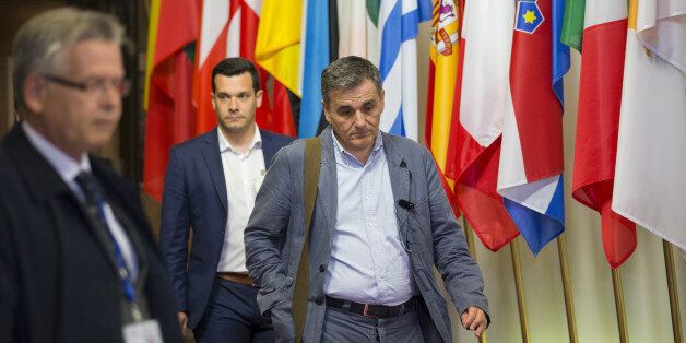 Euclid Tsakalotos, Greece's finance minister, leaves a Eurogroup meeting of European finance ministers in Brussels, Belgium, on Tuesday, May 24, 2016. Greece's creditors reached an agreement that will allow the release of 10.3 billion euros ($11.5 billion) of aid and committed to ease the nation's 321 billion euros of debt. Photographer: Jasper Juinen/Bloomberg via Getty Images