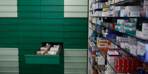 Packets of medicines sit in a drawer and on shelves inside a pharmacy store which remained open for emergencies during a strike in Athens, Greece, on Wednesday, June 10, 2015. Greece submitted fresh proposals for unlocking bailout funds three weeks before its financial safety net expires, as patience wears thin among its creditors. Photographer: Kostas Tsironis/Bloomberg via Getty Images