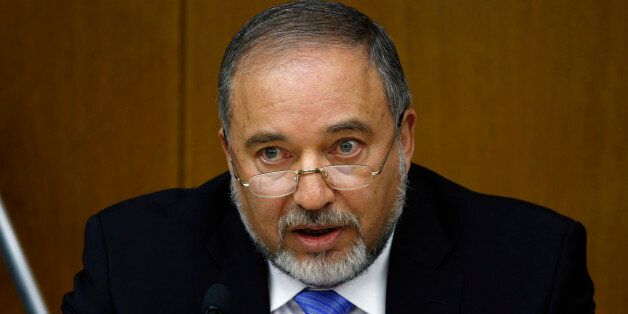 Israel's Foreign Minister Avigdor Lieberman speaks during a news conference at the Knesset, Israel's parliament, in Jerusalem July 7, 2014. Lieberman announced on Monday his party was ending its merger with Prime Minister Benjamin Netanyahu's Likud, saying differences over how to confront the Palestinian Hamas group had contributed to the break. REUTERS/Ronen Zvulun (JERUSALEM - Tags: POLITICS)