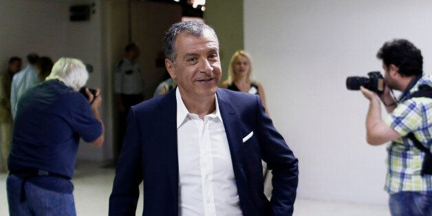 Stavros Theodorakis, leader of the To Potami party, leaves the studios of Greek state broadcaster ERT, also known as the Hellenic Broadcasting Organisation, after a television debate in Athens, Greece, on Thursday, Sept. 10, 2015. An opinion poll over the weekend showed that no party is projected to gain enough votes for an outright parliamentary majority, signaling coalition talks may be needed. Photographer: Kostas Tsironis/Bloomberg via Getty Images