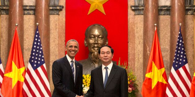 U.S. President Barack Obama, left, and Vietnamese President Tran Dai Quang shake hands at the Presidential Palace in Hanoi, Vietnam, Monday, May 23, 2016. The president is on a weeklong trip to Asia as part of his effort to pay more attention to the region and boost economic and security cooperation. (AP Photo/Carolyn Kaster)
