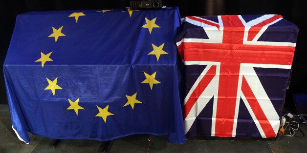 BERLIN, GERMANY - MAY 26: European Union (L) and British Union Jack flags hang at a meeting for British citizens living in Germany to discuss the implications of Great Britain leaving the European Union, known popularly as Brexit, on May 26, 2016 in Berlin, Germany. On June 23, 2016, UK citizens will vote on a post-legislative referendum on the country's membership in the European Union. Many British proponents of leaving the EU argue that it would allow the UK to better control immigration as well as save billions in membership fees as well as control trade deals and legislation, while those who wish to remain believe that leaving would decrease both the country's influence in world affairs as well as its security, and cause trade barriers with the rest of Europe. (Photo by Adam Berry/Getty Images)