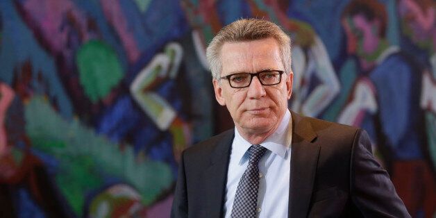 German Interior Minister Thomas de Maiziere arrives for the weekly cabinet meeting of the German government in Berlin, Germany, Wednesday, March 23, 2016. (AP Photo/Markus Schreiber)