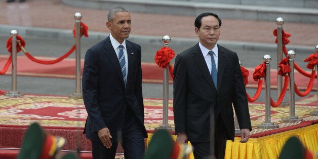 US President Barack Obama (L) and his Vietnamese counterpart Tran Dai Quang review an honour guard during a welcoming ceremony at the Presidential Palace in Hanoi on May 23, 2016.Obama was to meet communist Vietnam's senior leaders on May 23, kicking off a landmark visit that caps two decades of post-war rapprochement, as both countries look to push trade and check Beijing's growing assertiveness in the South China Sea. / AFP / POOL / HOANG DINH NAM (Photo credit should read HOANG DINH NAM/AFP/Getty Images)