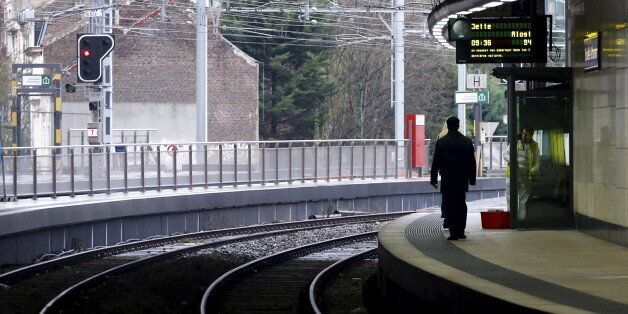 A pedestrian walks on a platform during a two-day rail strike at a railway station in central Brussels, Belgium, January 6, 2016. REUTERS/Francois Lenoir