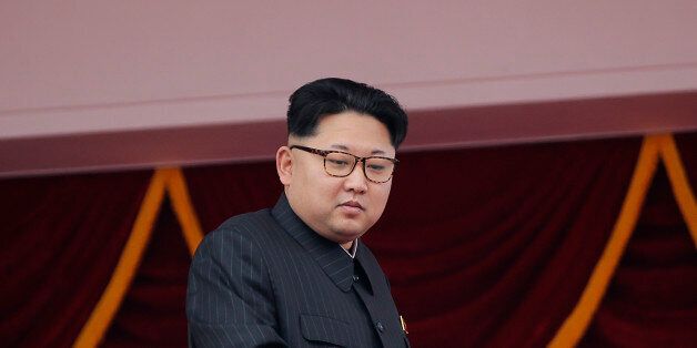 North Korean leader Kim Jong Un watches parade participants from a balcony at the Kim Il Sung Square on Tuesday, May 10, 2016, in Pyongyang, North Korea. Hundreds of thousands of North Koreans celebrated the country's newly completed ruling-party congress with a massive civilian parade featuring floats bearing patriotic slogans and marchers with flags and pompoms. (AP Photo/Wong Maye-E)