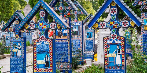 Carved wooden panels with epitaphs at crosses on graves, Merry Cemetery (Cimitirul Vesel) in Sapanta, Maramures Region, Romania.