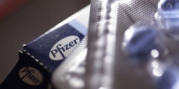 A blister pack containing Viagra tablets, produced by Pfizer Inc., stands outside an opened box on a pharmacy counter in this arranged photograph in London, U.K., on Monday, Dec. 14, 2015. European pharmaceuticals stocks in 2015 have outperformed the Stoxx 600 Index by 1.2 percentage points in U.S. dollar terms. Photographer: Simon Dawson/Bloomberg via Getty Images