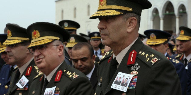 Turkish army commanders arrive to join family members and friends attending funeral prayers for pilot Lt. Burak Abikebahsi and army officer Mekan Sahin at the Kocatepe Mosque in Ankara, Turkey, Saturday, May 14, 2016. Eight military personnel have died in clashes with militants of the outlawed Kurdistan Workers Party, or PKK, in Hakkari province at the border with Iraq on Friday, statement from the military said.(AP Photo/Burhan Ozbilici)