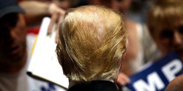 U.S. Republican presidential candidate Donald Trump signs autographs at a campaign rally in Spokane, Washington, U.S., May 7, 2016. REUTERS/Jake Parrish