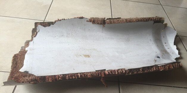 A piece of debris found by a South African family off the Mozambique coast in December 2015, which authorities will examine to see if it is from missing Malaysia Airlines flight MH370, is pictured in this handout photo released to Reuters March 11, 2016. REUTERS/Candace Lotter/Handout via Reuters ATTENTION EDITORS - THIS PICTURE WAS PROVIDED BY A THIRD PARTY. REUTERS IS UNABLE TO INDEPENDENTLY VERIFY THE AUTHENTICITY, CONTENT, LOCATION OR DATE OF THIS IMAGE. FOR EDITORIAL USE ONLY. NOT FOR SALE FOR MARKETING OR ADVERTISING CAMPAIGNS. NO RESALES. NO ARCHIVE. THIS PICTURE IS DISTRIBUTED EXACTLY AS RECEIVED BY REUTERS, AS A SERVICE TO CLIENTS. MUST ON SCREEN COURTESY CANDACE LOTTER. MANDATORY CREDIT