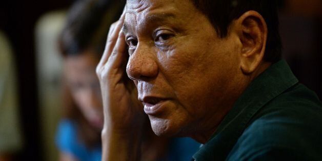 Philippines' President-elect Rodrigo Duterte, speaks to the media for the first time asince he claimed victory in the presidential election, at a restaurant in Davao City, on the southern island of Mindanao on May 15, 2016.Duterte vowed on May 15 to reintroduce capital punishment and give security forces 'shoot-to-kill' orders. / AFP / TED ALJIBE (Photo credit should read TED ALJIBE/AFP/Getty Images)