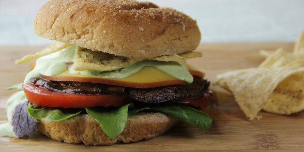 CORRECTS SPELLING OF PHOTOGRAPHER'S LAST NAME TO D'ARABIAN FROM MELISSA D'ARABIEN - This Sunday, May 8, 2016 photo shows a grilled portobello burger in Coronado, Calif. For this veggie burger, the secret is in the sauce. Portobellos make for a tastier choice than frozen options. (AP Photo/Melissa D'arabian)