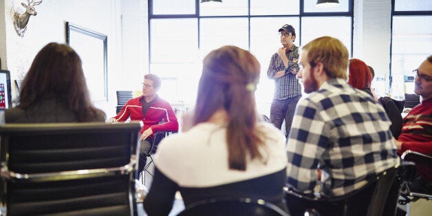 All office meeting in high tech startup office