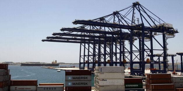 Newly installed container cranes are seen at the Piraeus Container Terminal, operated by Chinese state-owned shipping giant Cosco, near Athens, on Thursday, May 30, 2013. Greece is seeking Chinese participation in its major privatization program that is part of the bailed out country's commitments to international rescue lenders. (AP Photo/Thanassis Stavrakis)