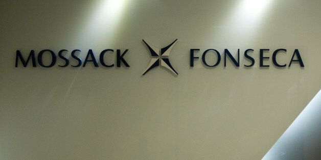 The logo of Panama law firm Mossack Fonseca is seen at the entrance of its Hong Kong office on April 14, 2016.The so-called Panama Papers, released by the International Consortium of Investigative Journalists this month, have exposed a key role played by Hong Kong and Singapore in funnelling wealth into tax havens. Mossack Fonseca's Hong Kong offices were their busiest in the world, the ICIJ analysis showed, setting up thousands of shell companies including some linked to China's top political brass, the city's richest man, Li Ka-shing, and movie star Jackie Chan. / AFP / AARON TAM / TO GO WITH AFP STORY BY Caroline HENSHAW (Photo credit should read AARON TAM/AFP/Getty Images)
