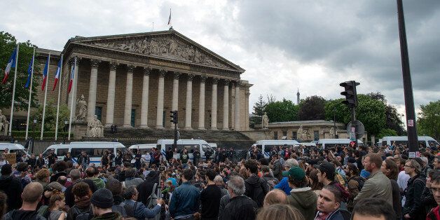 PARIS, FRANCE - MAY 12: Demonstrators gather in front of the National Assembly during the demonstration against the 'El Khomeri' law project on May 12, 2016 in Paris. According to the police department around 12,000 people demonstrated and 7 were arrested after clashes with the police. (Photo by Aurelien Meunier/Getty Images)