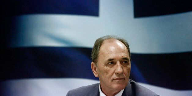 George Stathakis, Greece's economy minister, pauses during a news conference in Athens, Greece, on Wednesday, Sept. 23, 2015. The new government in Athens, named late on Tuesday, will have to immediately start implementing a wide slate of politically toxic austerity measures that will test its cohesion and could result in yet another election if enough lawmakers waver. Photographer: Kostas Tsironis/Bloomberg via Getty Images