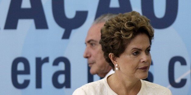 Brazil's President Dilma Rousseff (front) and Vice President Michel Temer arrive at a ceremony to announce the adaptation criteria in the AM and FM broadcasting grants, at the Planalto Palace in Brasilia, Brazil, November 24, 2015. REUTERS/Ueslei Marcelino