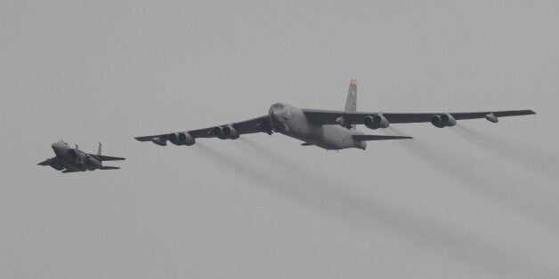 A U.S. Air Force B-52 bomber flies over Osan Air Base in Pyeongtaek, South Korea, Sunday, Jan. 10, 2016. The powerful U.S. B-52 bomber flew low over South Korea on Sunday, a clear show of force from the United States as a Cold War-style standoff deepened between its ally Seoul and North Korea following Pyongyang's fourth nuclear test. (AP Photo/Ahn Young-joon)