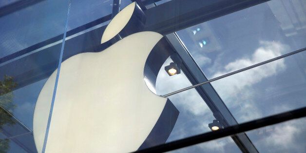 The Apple logo is seen atop the Apple Store Thursday, March 31, 2016, in Palo Alto, Calif. (AP Photo/Eric Risberg)