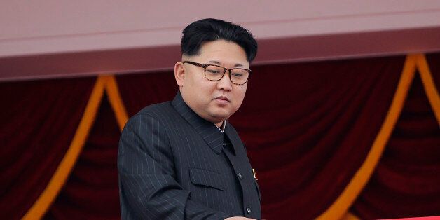 North Korean leader Kim Jong Un watches parade participants from a balcony at the Kim Il Sung Square on Tuesday, May 10, 2016, in Pyongyang, North Korea. Hundreds of thousands of North Koreans celebrated the country's newly completed ruling-party congress with a massive civilian parade featuring floats bearing patriotic slogans and marchers with flags and pompoms. (AP Photo/Wong Maye-E)