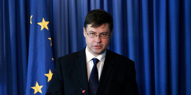 European Commissioner for Euro and Social Dialogue Valdis Dombrovskis speaks to the media during a press conference after a meeting with Cypriot Financial minister Charis Georgiades, at the foreign ministry house in capital Nicosia, Cyprus, Thursday, March 3, 2016. Dombrovskis lauded bailed-out Cyprusâ commitment to implementing structural reforms for turning the economy around and putting the Eurozone member back on a growth trajectory after nearly going bankrupt three years ago. (AP Photo/Petros Karadjias)