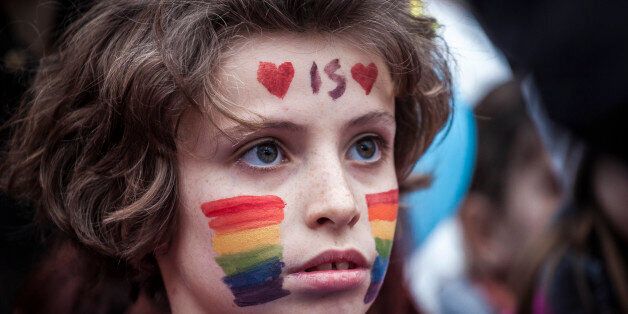 ROME, ITALY - 2016/03/05: A boy with his face painted (love is love) takes part in a protest against the bill on civil union which was approved recently by the Italian Senate. Thousands of supporters of LGBT associations take part in a protest in Rome to support gay rights and against the bill on civil union which was approved recently by the Italian Senate that grant legal recognition to civil unions but a provision to allow gay adoption was dropped from the bill in order to ensure passage in the Senate. (Photo by Giuseppe Ciccia/Pacific Press/LightRocket via Getty Images)