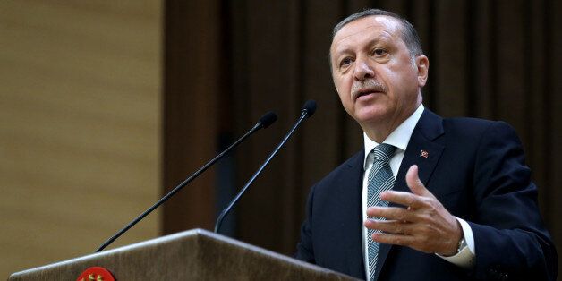 Turkey's President Recep Tayyip Erdogan addresses local administrators at his palace in Ankara, Turkey, Wednesday, May 4, 2016. Long-denied tensions between Erdogan and Prime Minister Ahmet Davutoglu are beginning to surface publicly, leading to speculation that the countryâs powerful leader may be considering replacing the premier with a figure more willing to take a backseat role. (Murat Cetinmuhurdar, Presidential Press Service, Pool via AP )