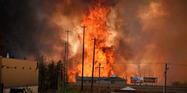Flames rise in Industrial area south Fort McMurray, Alberta Canada May 3, 2016. Terry Reith/CBC News/Handout via REUTERS ATTENTION EDITORS - THIS IMAGE WAS PROVIDED BY A THIRD PARTY. EDITORIAL USE ONLY. NO RESALES. NO ARCHIVE. MANDATORY CREDIT. ONE TIME USE ONLY.