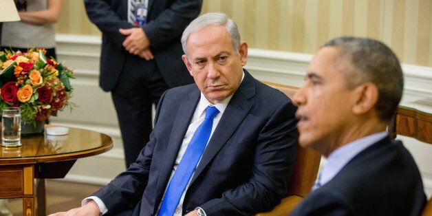 President Barack Obama speaks to members of the media as he meets with Israeli Prime Minister Benjamin Netanyahu in the Oval Office of the White House in Washington, Monday, Nov. 9, 2015. The president and prime minister sought to mend their fractured relationship during their meeting, the first time they have talked face to face in more than a year. (AP Photo/Andrew Harnik)