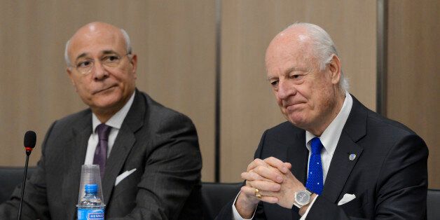 FILE-- In this Fiday April 22, 2016, file photo, UN special envoy for Syria envoy Staffan de Mistura, right, and his deputy Ramzy Ezzeldin Ramzy attend a meeting with the Syrian government delegation during Syria peace talks at the United Nations office in Geneva, Switzerland. A military buildup in northern Syria coupled with heavy fighting and mounting civilian casualties spells the end of a cease-fire that for two months brought much needed relief to war-stricken Syrians, ushering in what could be an even more ruinous chapter in the country's five-year-old conflict. (Fabrice Coffrini/Pool Photo via AP, File)