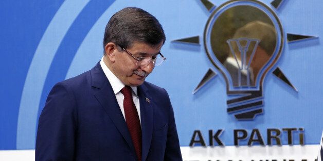 Turkish Prime Minister Ahmet Davutoglu leaves after a press conference at the headquarters of his ruling Justice and Development Party, AKP, in Ankara, Turkey, Thursday, May 5, 2016. Davutoglu announced his resignation on Thursday, paving the way for the country's president to pursue a tighter grip on power. (AP Photo/Burhan Ozbilici)