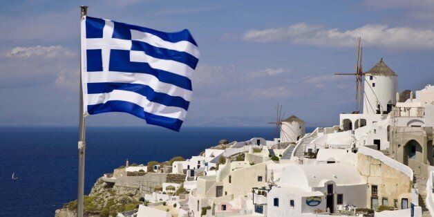 'Greek flag over village, Santorini, Greece'