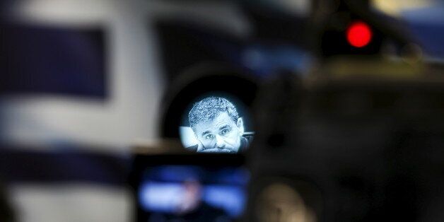 Greek Finance Minister Euclid Tsakalotos is seen through a camera viewfinder during a news conference at the ministry in Athens, Greece, January 18, 2016. REUTERS/Alkis Konstantinidis