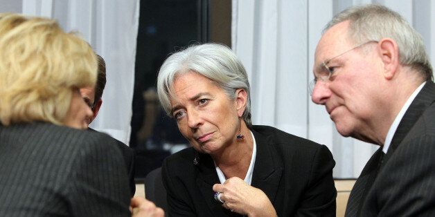 France's Finance Minister Christine Lagarde, center, shares a word with Spain's counterpart Elene Salgado, left and Germany's Finance Minsiter Wolfgang Schauble at the start of an Eurogroup meeting at the EU Council in Brussels, Monday Jan. 18, 2010. (AP Photo/Geert Vanden Wijngaert)
