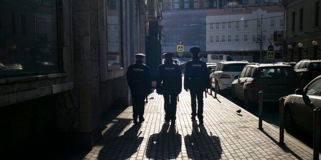 Russian police officers patrol a street in the center of Moscow, Russia, Tuesday, April 12, 2016. (AP Photo/Alexander Zemlianichenko)