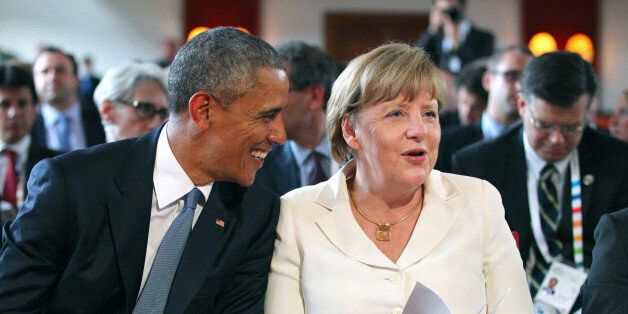 U.S. President Barack Obama and German Chancellor Angela Merkel attend a concert at the hotel castle Elmau in Kruen, Germany, June 7, 2015. Leaders from the Group of Seven (G7) industrial nations met on Sunday in the Bavarian Alps for a summit overshadowed by Greece's debt crisis and ongoing violence in Ukraine. REUTERS/Karl-Josef Hildenbrand/Pool