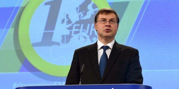 European commissioner for the Euro and social dialogue Valdis Dombrovskis holds a press conference on 'Completing Europe's Economic and Monetary Union - Moving ahead under Stage 1' at the European Commission in Brussels on October 21, 2015. AFP PHOTO / EMMANUEL DUNAND (Photo credit should read EMMANUEL DUNAND/AFP/Getty Images)