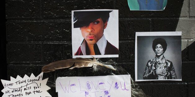 MINNEAPOLIS, MN - APRIL 22: Photos of Prince are attached to the wall outside of the First Avenue nightclub where fans have created a memorial to the artist on April 22, 2016 in Minneapolis, Minnesota. Prince, 57, was pronounced dead shortly after being found unresponsive yesterday at his Paisley Park Studio in Chanhassen, Minnesota near Minneapolis. (Photo by Scott Olson/Getty Images)
