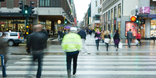 Sweden, Stockholm, pedestrians crossing street