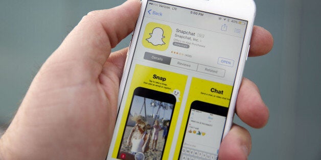 The Snapchat Inc. application is displayed in the App Store on an Apple Inc. iPhone 6 in this arranged photograph taken in the Venice Beach neighborhood of Los Angeles, California, U.S., on Wednesday, March 2, 2016. People using the application for disappearing photos view 8 billion videos a day, the same number that Facebook reports, the CEO Evan Spiegel told an audience at the Morgan Stanley technology conference Photographer: Patrick T. Fallon/Bloomberg via Getty Images